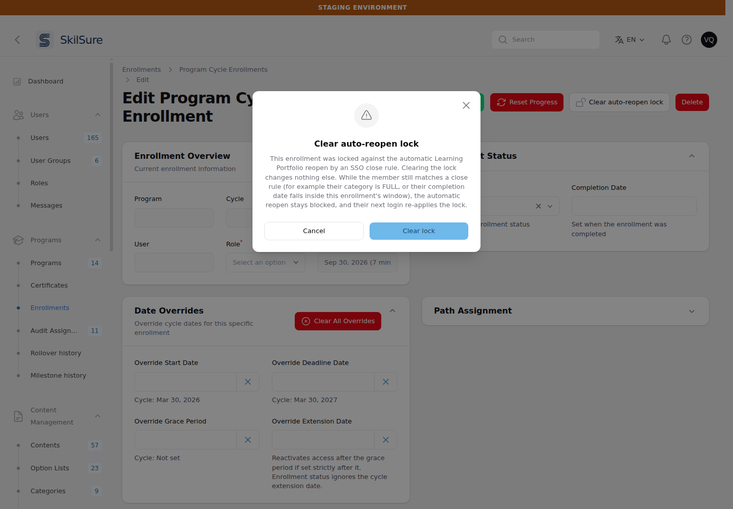 The Clear auto-reopen lock confirmation on an enrollment's edit page, explaining that clearing changes nothing else and that a matching member's next sign-in locks it again.